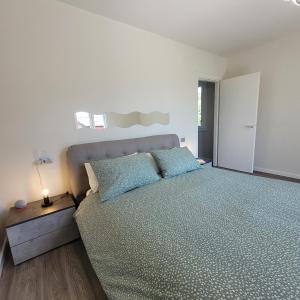 Postel nebo postele na pokoji v ubytování Garden Relais Mountain Lake Iseo Hospitality