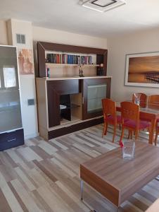 a living room with a dining table and a fireplace at Tío Abraham in El Raso
