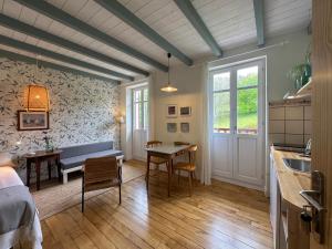 a living room with a table and a bench in it at Apartamentos rurales AGIÑAGA in Irún +50 photos