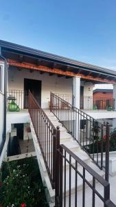 a balcony of a house with a staircase at La Bianca Dimora B&B in Gioia del Colle