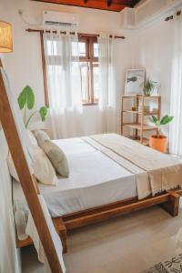Ένα ή περισσότερα κρεβάτια σε δωμάτιο στο Kelani Retreat