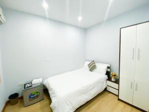 Postel nebo postele na pokoji v ubytování Eco Nest Hotel Đình Ngang