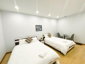 Postel nebo postele na pokoji v ubytování Eco Nest Hotel Đình Ngang