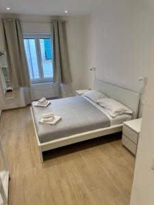 Postel nebo postele na pokoji v ubytování Sapri 29 Rooms