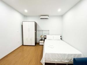 Postel nebo postele na pokoji v ubytování Eco Nest Hotel Đình Ngang