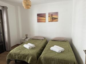 En eller flere senge i et værelse på El Puertito Beach Retreat + 21 billeder