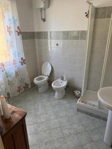 a bathroom with a toilet and a shower and a sink at Casa Franceschini in Poggio Mirteto +20 photos