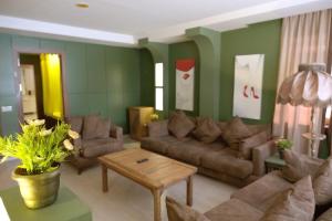 a living room with a couch and a table at Park 12 in Kavaklıdere