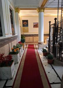 a red carpet in the hallway of a building at Pa la ce court in Cairo
