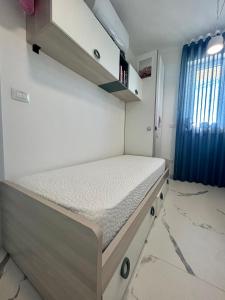 a small bedroom with a bed in a room at Vista mare in Vasto +22 photos