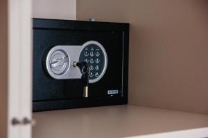 a key hooked up to a wall with a door at Palazzo Apartments in Rimavská Sobota