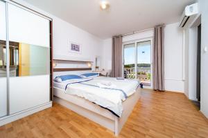 Postel nebo postele na pokoji v ubytování Guesthouse Mira