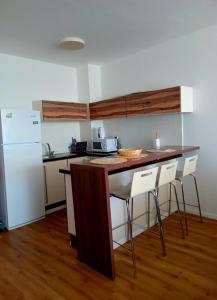a kitchen with a counter top and a refrigerator at Caesarea Sea View Suite in Caesarea