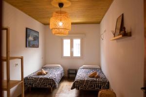 Ένα ή περισσότερα κρεβάτια σε δωμάτιο στο 3BR Fronton Wave - Ocean View & Parking