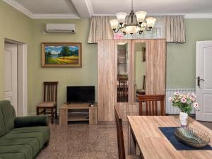 a living room with a couch and a table at VILA TARA in Sutomore