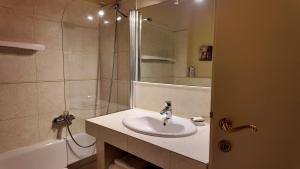 a bathroom with a sink and a shower at Relais Corte Paradiso in Peschiera del Garda
