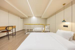Postel nebo postele na pokoji v ubytování 珠珠酒店 上海浦东国际机场店