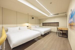 Postel nebo postele na pokoji v ubytování 珠珠酒店 上海浦东国际机场店