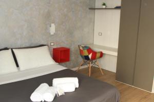 Posteľ alebo postele v izbe v ubytovaní san rocco apartments