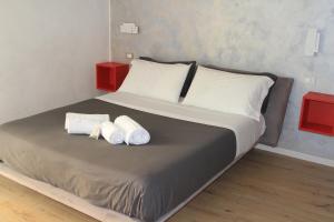 Posteľ alebo postele v izbe v ubytovaní san rocco apartments