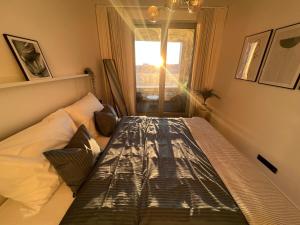 Ένα ή περισσότερα κρεβάτια σε δωμάτιο στο AH Sky park 3D - 20th Floor sunset views - parking