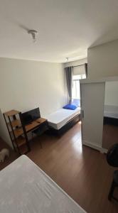 En eller flere senge i et værelse på Santa Branca Easy Stay 01