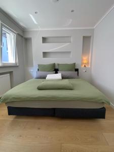 Кровать или кровати в номере Ausblick residence