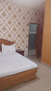Postel nebo postele na pokoji v ubytování Hotel Lile John
