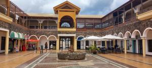 a building with a fountain in the middle of a courtyard at Casa Karina in Parque Holandes