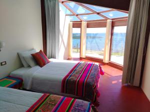 Voodi või voodid majutusasutuse Luquina Experience Lodge toas
