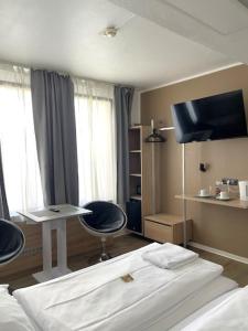 Postel nebo postele na pokoji v ubytování Sonata City Hotel