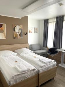 Postel nebo postele na pokoji v ubytování Sonata City Hotel + 9 fotografií