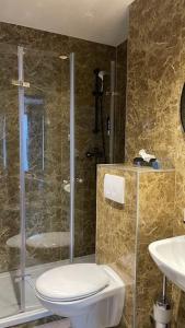 Koupelna v ubytování Sonata City Hotel
