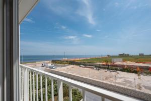 a balcony with a view of the beach and the ocean at Sogno di Mare in Bari