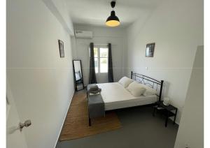 Postel nebo postele na pokoji v ubytování Spanos Apartments - Panteli