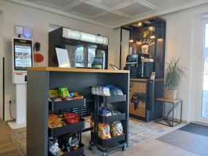 a store with a shelf with food on it at Hotel Fuchs & Hase SELF CHECK IN in Rosegg