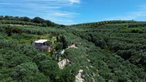 an aerial view of a house on top of a mountain at Eco Friendly Country Home in Kókkinos Pírgos