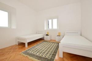 Postel nebo postele na pokoji v ubytování Apartment Forte Mare