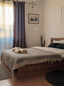 Ένα ή περισσότερα κρεβάτια σε δωμάτιο στο Cozy Peacefull Apartment with amazing view