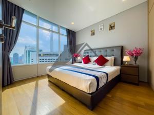 a bedroom with a large bed with a large window at Vortex Residence KLCC ,12 Jalan Sultan Ismail Kuala Lumpur in Kuala Lumpur