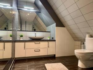a bathroom with a sink and a toilet at I&A Residence - Old Town in Tallinn +1 photo