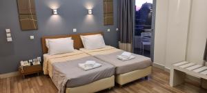 Postel nebo postele na pokoji v ubytování Ariston Hotel