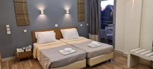Postel nebo postele na pokoji v ubytování Ariston Hotel