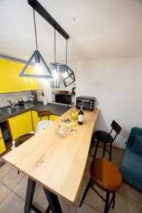 a kitchen with a wooden table in a room at Maison Citron - Explore Courmayeur Mont Blanc in Villair