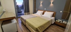 Postel nebo postele na pokoji v ubytování Ariston Hotel