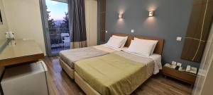 Postel nebo postele na pokoji v ubytování Ariston Hotel