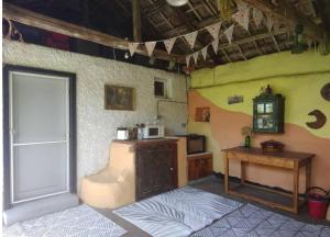 a room with a door and a table and a counter at Rustic Village Retreat in Veliko Tŭrnovo
