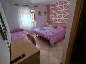 Postel nebo postele na pokoji v ubytování Le Rondini Affittacamere