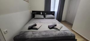 En eller flere senge i et værelse på LARIX luxury APARTMENTS