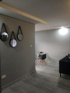 a room with two lights on a wall at Fully serviced apartments solwezi in Solwezi